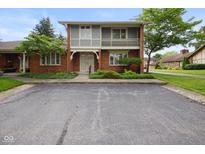 Inviting brick home with balcony and well-kept greenery, offering comfortable living at 3975 Offshore Dr, Columbus, IN 47203