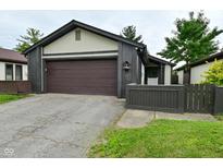 Charming home with a gray and white exterior, front yard, and a two-car garage at 4029 Gamay Ln, Indianapolis, IN 46254