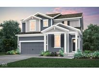 Charming two-story home boasts a landscaped yard and a modern gray exterior at 6849 Seabiscuit Rd, Whitestown, IN 46075