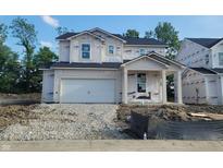 Unfinished two-story home with attached garage and covered entry offers a glimpse of future possibilities at 6849 Seabiscuit Rd, Whitestown, IN 46075