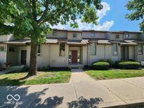 Charming townhouse featuring a well-maintained lawn and sidewalks in a desirable neighborhood at 70 Lookout Ridge Dr, Columbus, IN 47201