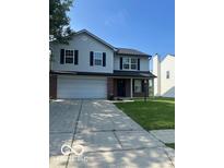 Two-story home with a two-car garage and concrete driveway at 7549 Stockard St, Indianapolis, IN 46239
