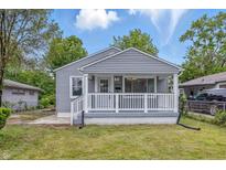 Charming home featuring a welcoming front porch and well-maintained siding at 3334 N Chester Ave, Indianapolis, IN 46218