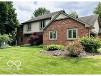 Charming two-story home featuring a manicured front lawn and inviting curb appeal at 1941 Spruce Dr, Carmel, IN 46033