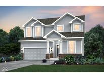 Charming two-story home with inviting curb appeal and manicured landscaping, plus an attached two-car garage at 2598 Penn Ave, Plainfield, IN 46168
