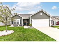 Charming single-Gathering home with green lawn, concrete driveway, and inviting front entrance at 6556 Sulgrove Pl, Indianapolis, IN 46221