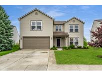 Charming two-story home featuring a two-car garage and well-maintained front yard at 8088 Lantern Ln, Pendleton, IN 46064