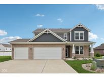 Charming two-story home with brick and siding exterior and a three-car garage at 13163 N Departure W Blvd, Camby, IN 46113