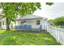 Charming single-story home with blue front porch and white picket fence at 2840 Denison St, Indianapolis, IN 46241