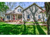 Charming two-story home featuring a welcoming front porch and well-manicured lawn at 3533 Alexandria Pike, Anderson, IN 46012