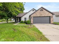 Charming single-Gathering home with a brick and siding facade, and an attached two-car garage at 3926 Rosefinch Cir, Indianapolis, IN 46228
