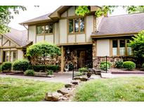 Charming Tudor-style home with stone accents and manicured landscaping in a desirable neighborhood at 3935 Offshore Dr, Columbus, IN 47203