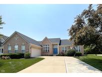 Charming single-Gathering home with brick facade, blue door, driveway, and well-manicured lawn at 5010 Cabrillo Dr, Plainfield, IN 46168