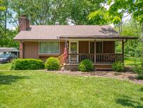 Charming single-story home with a covered front porch and well-maintained lawn at 10307 Wilson Rd, Brownsburg, IN 46112