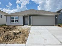 Charming single-story home featuring a two-car garage, concrete driveway, and low-maintenance landscaping at 11282 N Quillow Way, Monrovia, IN 46157