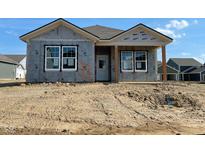 New construction home featuring a covered porch and bright windows, awaiting landscaping to complete its charming facade at 15363 Alperton Rd, Fishers, IN 46037