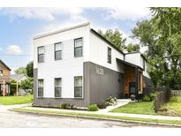 Contemporary two-story home showcases a well-manicured lawn and a modern, two-tone facade at 1620 W New York St, Indianapolis, IN 46222