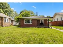 Charming brick home with well-maintained lawn and inviting curb appeal at 4125 Bowman Ave, Indianapolis, IN 46227