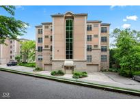 Beautiful multi-story building featuring a brick and stucco facade with a dramatic glass atrium at 6760 Spirit Lake Dr # 11, Indianapolis, IN 46220