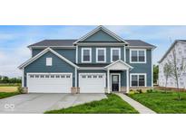 Charming two-story home featuring a three-car garage and eye-catching blue siding at 2750 Glade Ave, Plainfield, IN 46168