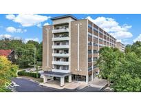 Spacious brick apartment building featuring multiple balconies with lush tree surround at 3965 N Meridian St # 3J West, Indianapolis, IN 46208