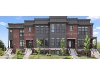 Stunning townhouse with brick and modern siding, steps and manicured landscaping at 420 Monon Wy Dr, Carmel, IN 46032