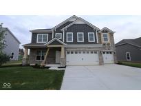 Charming home with stone accents, a large garage, and manicured lawn for curb appeal and outdoor enjoyment at 4947 Amber Crest Dr, Brownsburg, IN 46112