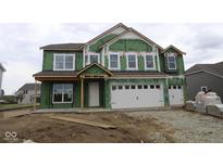 New two-story home featuring large windows and a two-car garage in an unfinished construction stage at 4947 Amber Crest Dr, Brownsburg, IN 46112