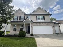 Charming two-story home with brick and siding, black shutters, and a well-maintained lawn at 1518 Valdarno Dr, Greenwood, IN 46143
