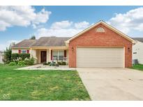 Charming one-story home with brick accents and well-maintained lawn and landscaping at 2114 Turning Leaf Dr, Franklin, IN 46131
