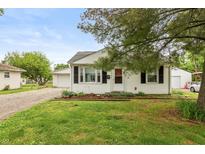 Charming single-story home with a manicured lawn and inviting front porch entrance at 2704 13Th St, Columbus, IN 47201
