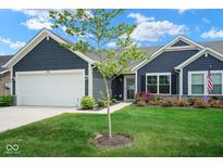 Charming single-story home boasts a manicured lawn and inviting curb appeal at 7184 Lillian Pl, Cumberland, IN 46229