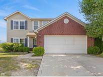 Charming two-story home featuring a two-car garage, well-maintained lawn, and inviting curb appeal at 11614 Gosling Dr, Indianapolis, IN 46229