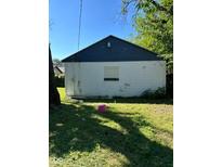 View of backyard garage of building shows blue painted roof with white siding on a sunny day at 1920 Kildare Ave, Indianapolis, IN 46218