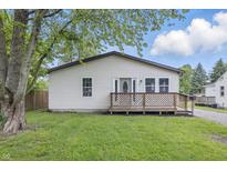 Charming home featuring a cozy front porch, well-maintained lawn, and welcoming curb appeal at 450 N Fenton Ave, Indianapolis, IN 46219