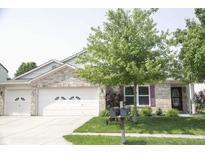 Charming single-Gathering home with a two-car garage, well-manicured lawn and mature tree at 10112 Split Rock Way, Brownsburg, IN 46112