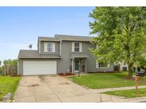 Charming two-story home with attached garage, well-kept lawn and mature trees at 2782 Branigin Creek Blvd, Franklin, IN 46131
