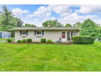 Charming ranch home featuring a well-manicured lawn and tidy landscaping at 3201 Chamberlin Dr, Indianapolis, IN 46227