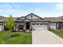 Charming one-story home with well-manicured lawn, garden beds, and a two-car garage at 794 Harley Ln, Westfield, IN 46074