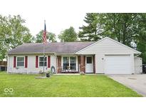 Charming single-story home featuring a well-manicured lawn, red shutters, and a cozy front porch at 254 Bittersweet Dr, Whiteland, IN 46184