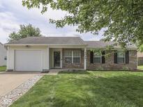 Charming single-story home with a brick facade, manicured lawn, and attached one car garage at 2756 Branigin Creek Blvd, Franklin, IN 46131