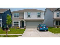 Charming two-story home featuring neutral siding, a two-car garage, and a well-manicured front lawn at 2916 W Bargello Ln, Monrovia, IN 46157