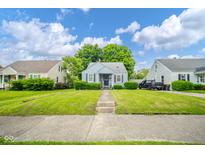 Charming single Gathering home with blue siding, front porch, well maintained lawn, and nice curb appeal at 3004 Sheridan St, Anderson, IN 46016