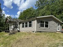 Ranch style home with a light colored exterior, open porch and windows with light colored trim at 3587 Lower Patton Park Rd, Martinsville, IN 46151