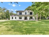 Stunning two-story home with a well-manicured lawn and a classic covered front porch perfect for relaxing at 5710 W 650 N, Thorntown, IN 46071
