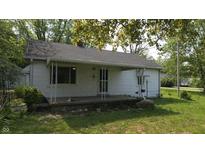 Quaint one story home with a small front porch and traditional architectural details at 6484 S State Road 39, Clayton, IN 46118