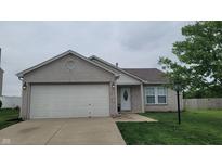 Charming single-story home featuring a two-car garage and a well-maintained front yard at 713 Driftwood Cir, Danville, IN 46122