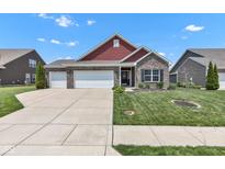 Charming single-Gathering home with a brick facade, three-car garage and well-manicured lawn at 8044 Yarmouth Way, Indianapolis, IN 46239