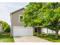 Charming two-story home with attached garage and mature landscaping at 10273 Haag Rd, Brownsburg, IN 46112