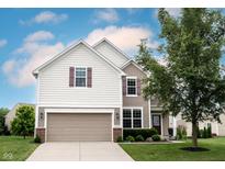 Charming two-story home with a two-car garage and well-manicured lawn at 14514 Glapthorn Rd, Fishers, IN 46037